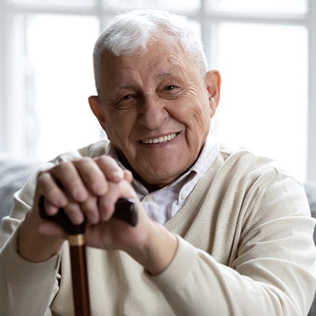 Smiling senior man enjoying results of All-on-4 in Katy