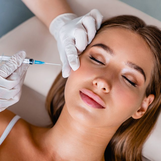 Woman in Katy receiving BOTOX® injection in the side of her face