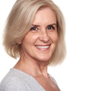 Senior woman enjoying the long-term benefits of dental implants