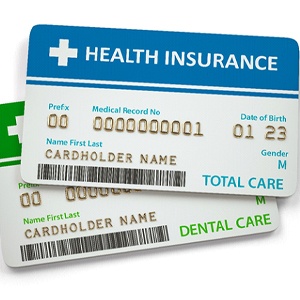 Cards for mental and dental insurance against white background