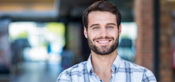 Man smiling after oral and maxillofacial pathology