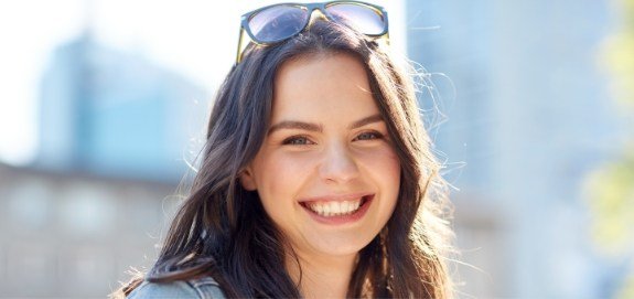 Woman smiling after wisdom tooth extractions