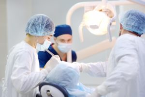 Surgical team working while patient is under general anesthesia