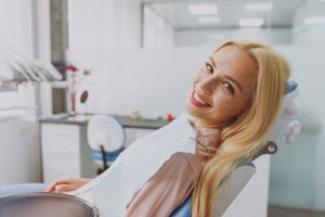 Relaxed, happy dental patient in treatment chair