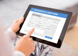 Insurance claim form on electronic tablet
