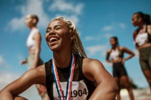 Happy athlete with a medal around her neck