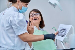 Adult patient talking with dental team member